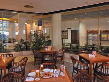 a restaurant with tables and chairs