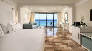 a room with a large bed and a glass door