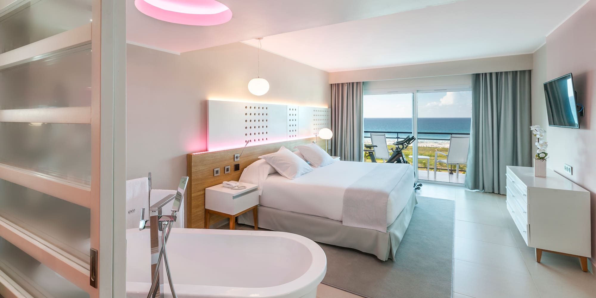 a room with a bed and bathtub