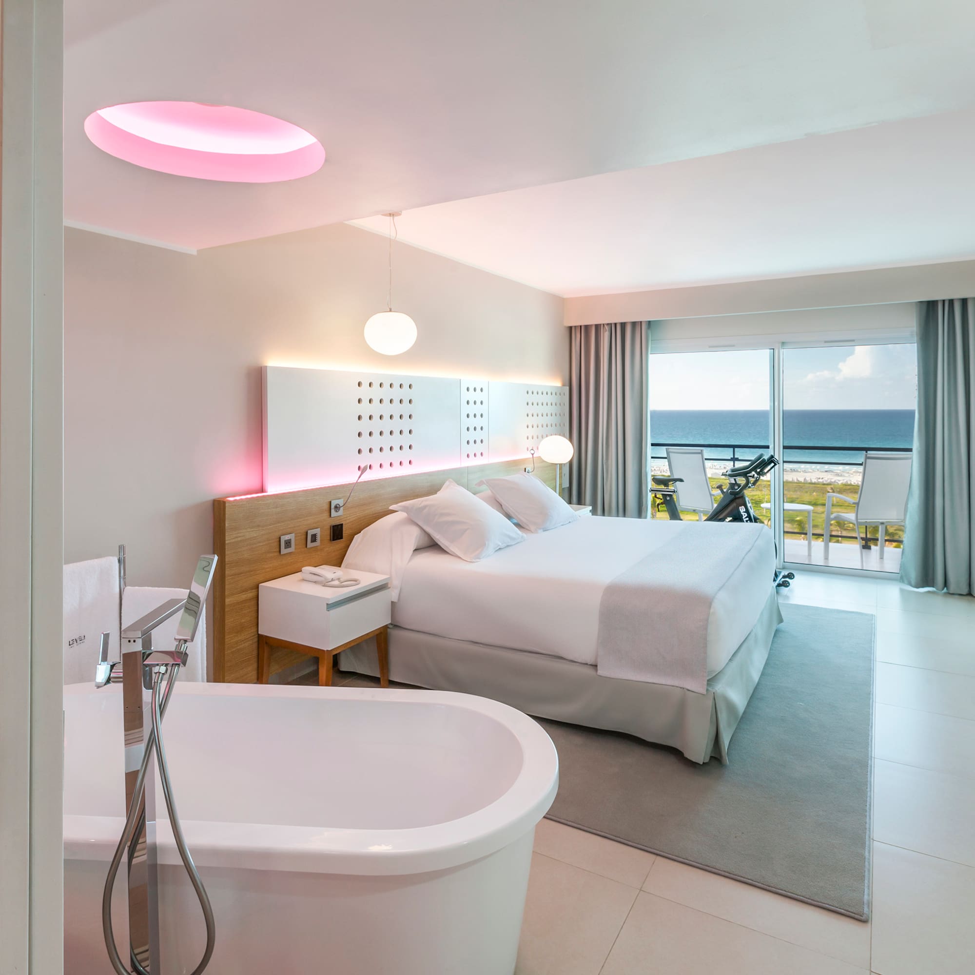 a room with a bed and bathtub
