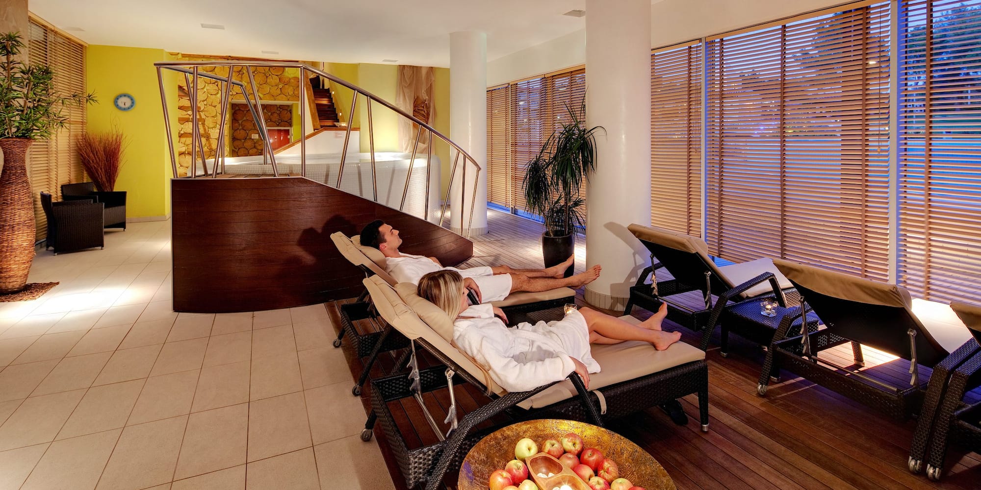 a group of people lying on chairs in a room