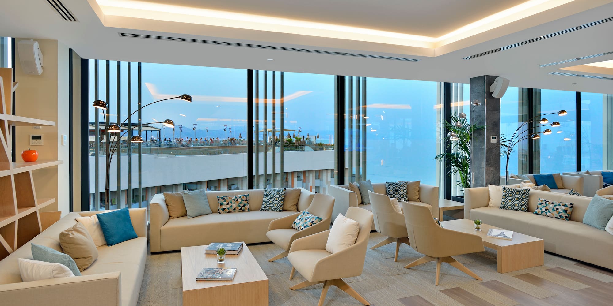 a room with a couch and chairs