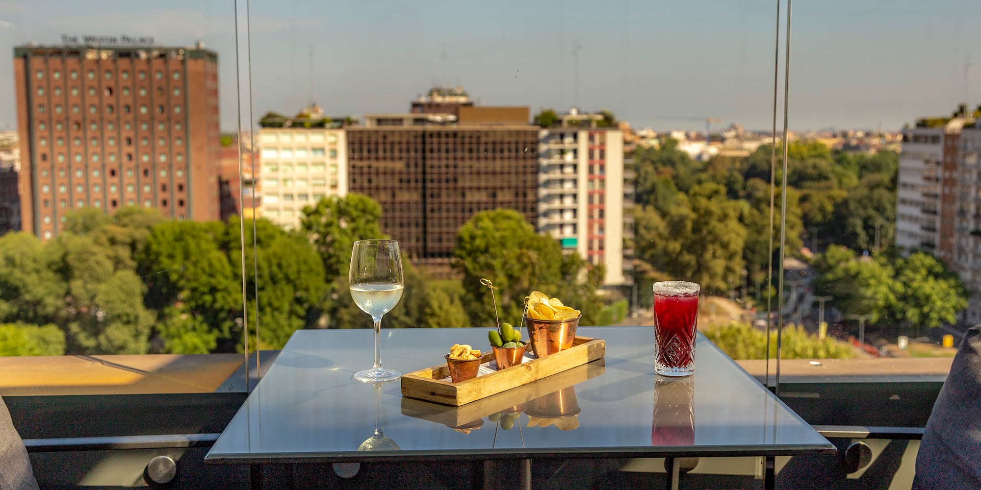 a table with food on it and a glass of wine on it