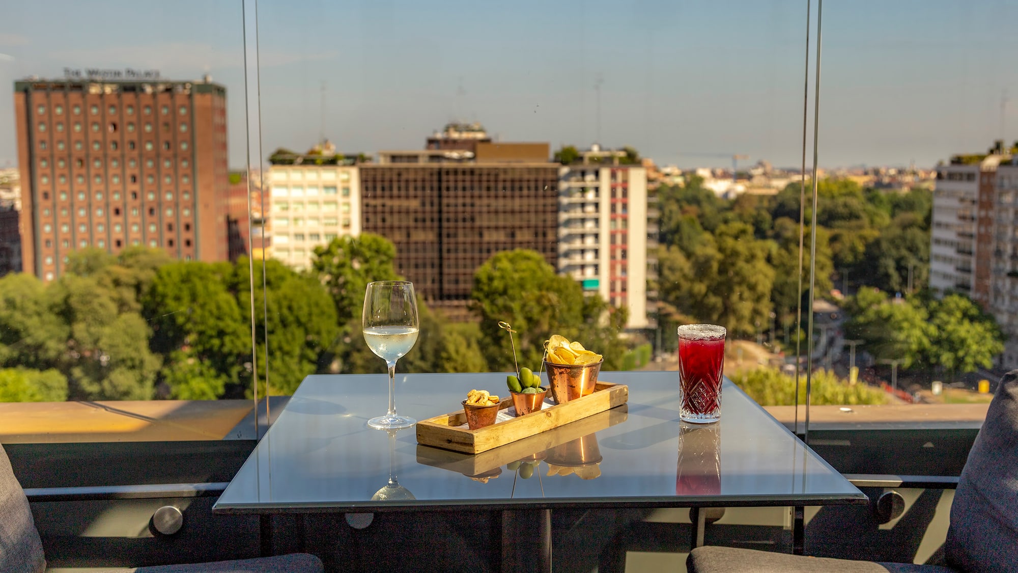 a table with food on it and a glass of wine on it