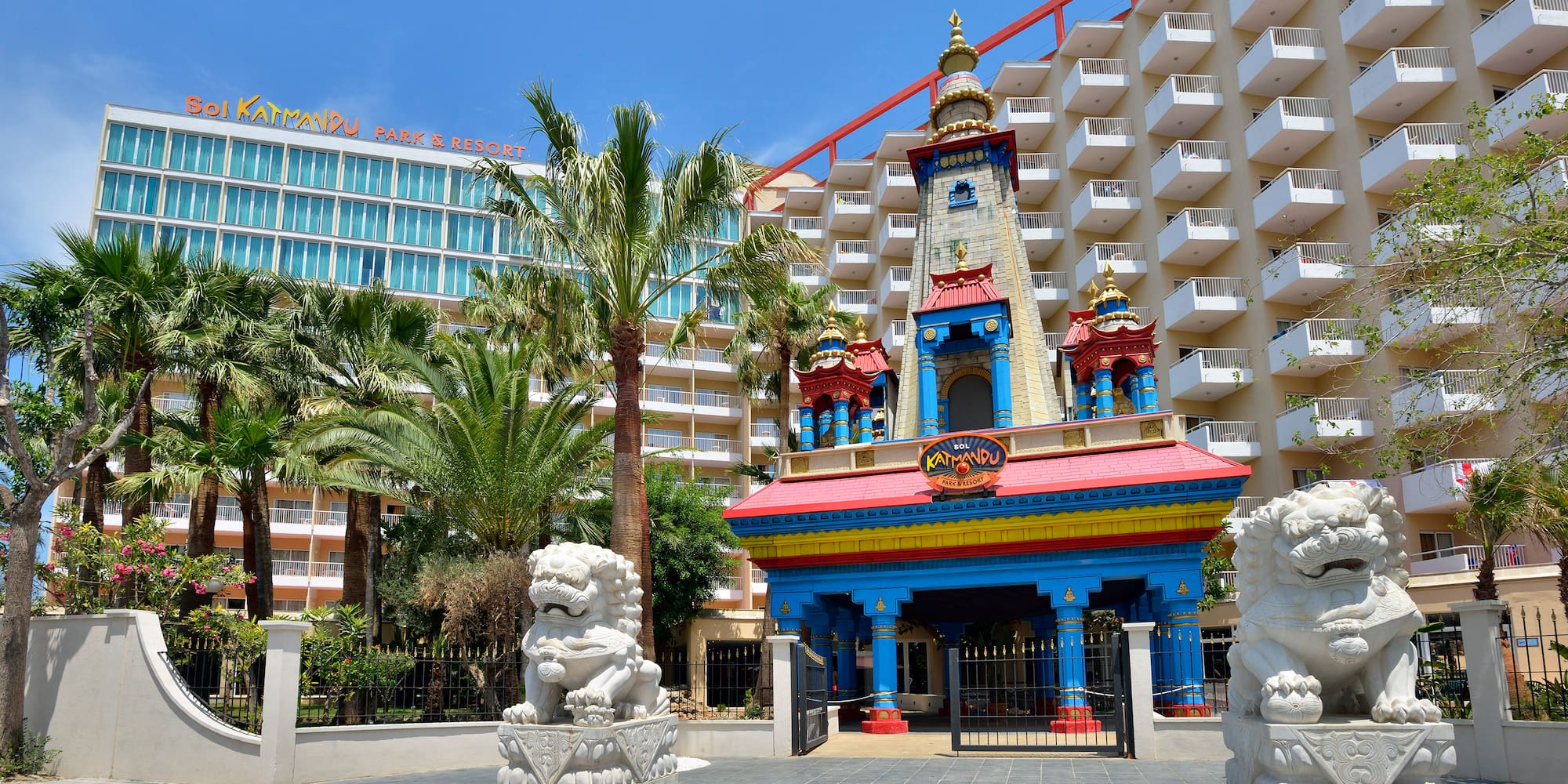 a building with a lion statue in front of a hotel