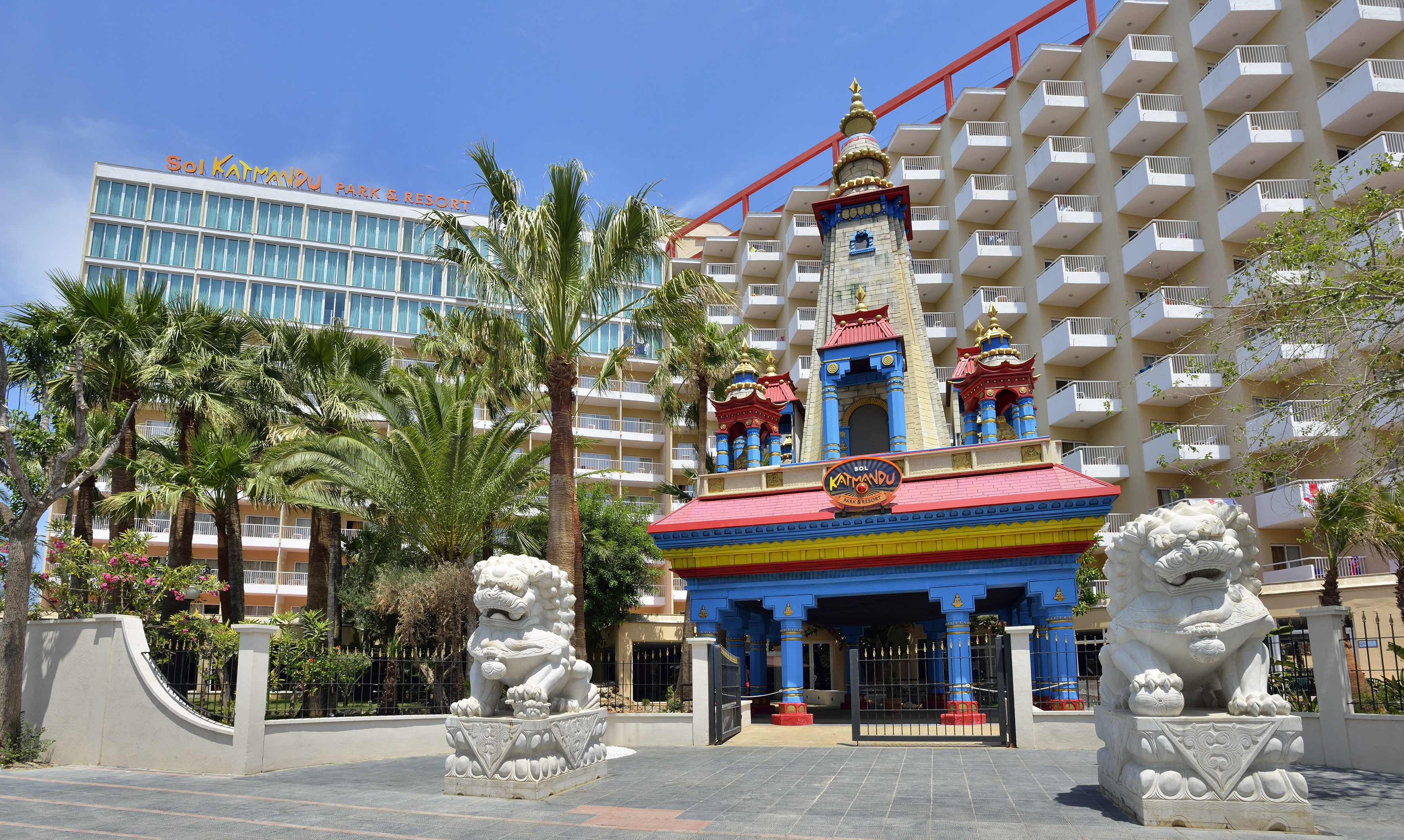 Sol Katmandu Park & Resort entrance, ornate building, white lion statues, large hotel.