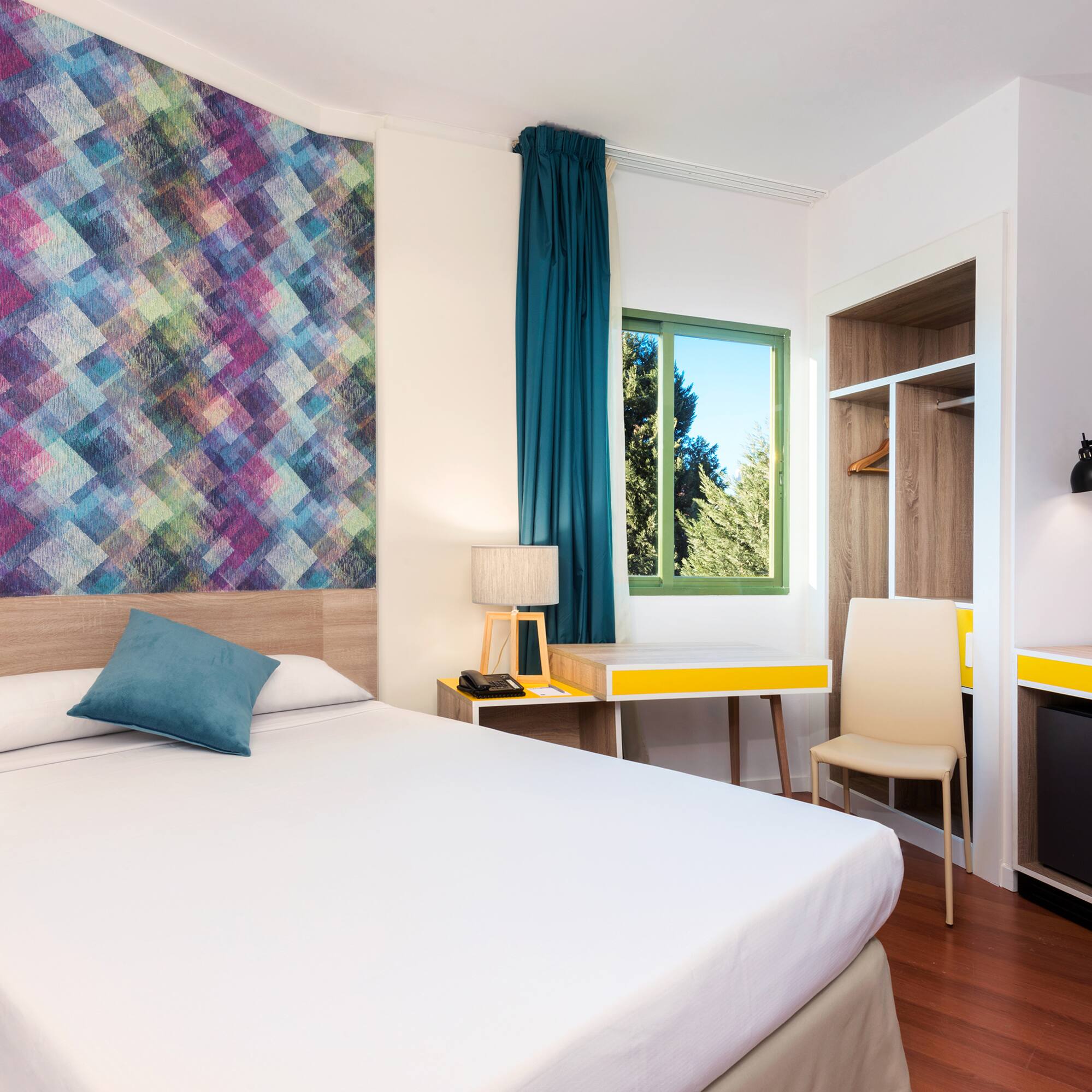 a room with a bed and a desk