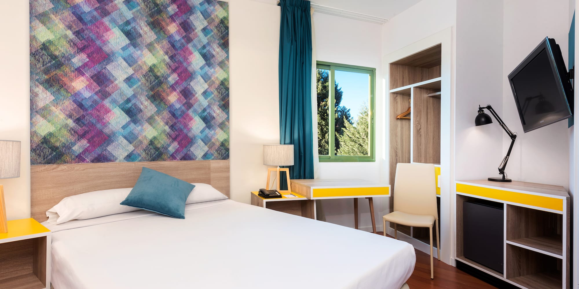 a room with a bed and a desk