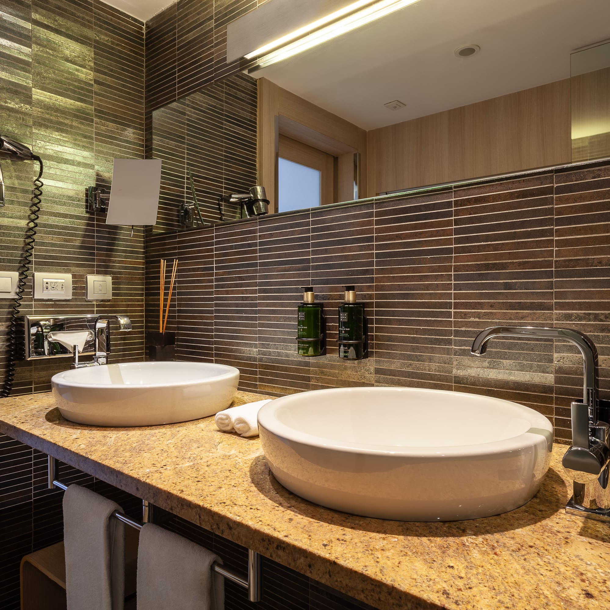 a bathroom with a sink and mirror