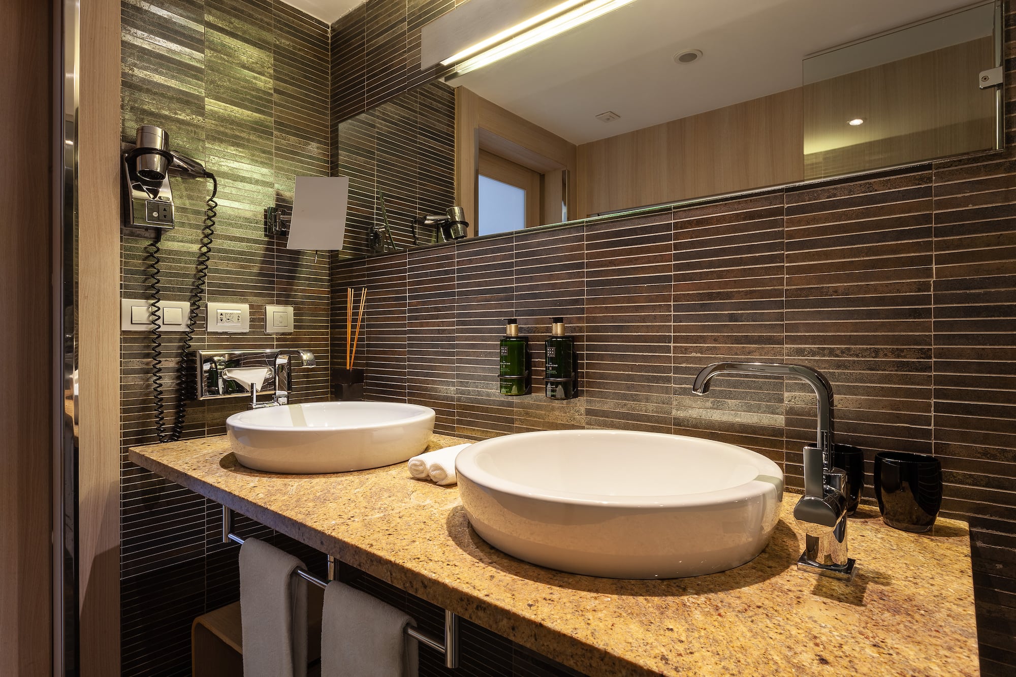 a bathroom with a sink and mirror