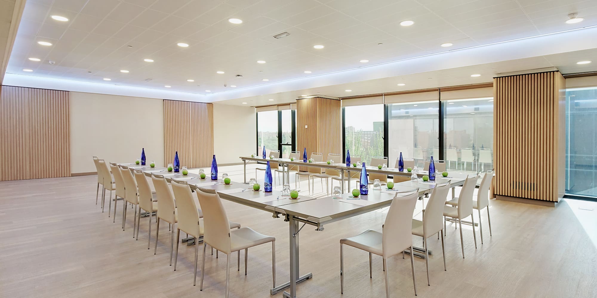 a room with a long table and chairs