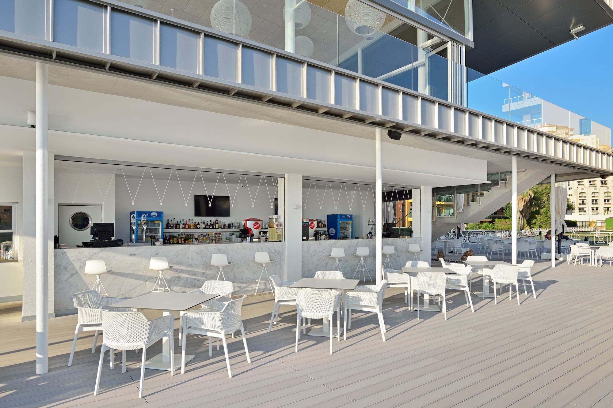 a white tables and chairs outside a building