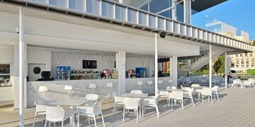 a white tables and chairs outside a building