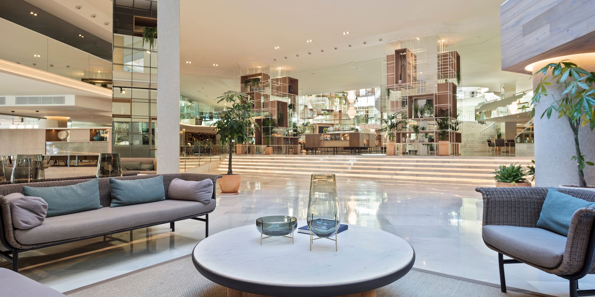 a large room with a large glass wall and a large white floor