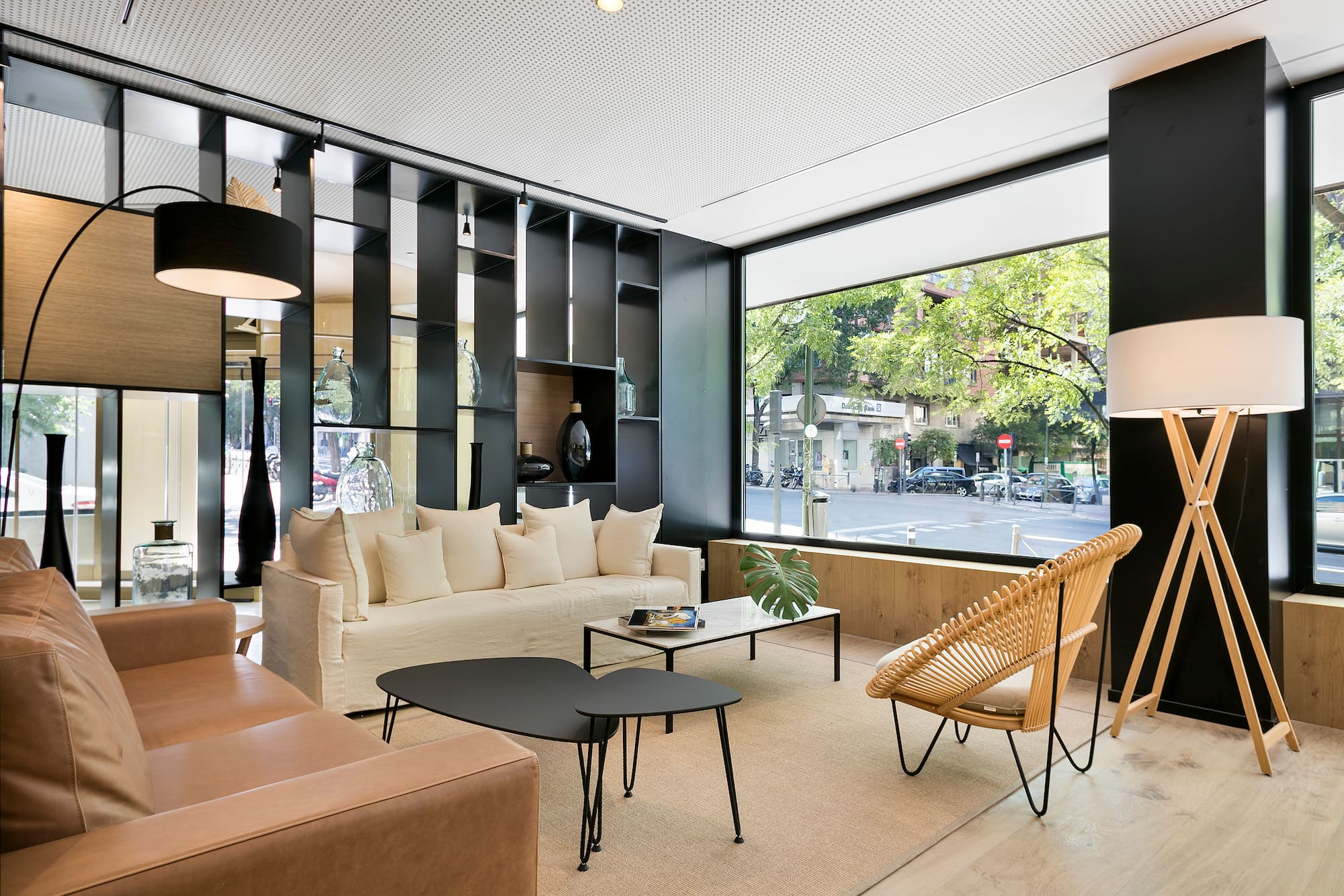 a room with a couch and chairs