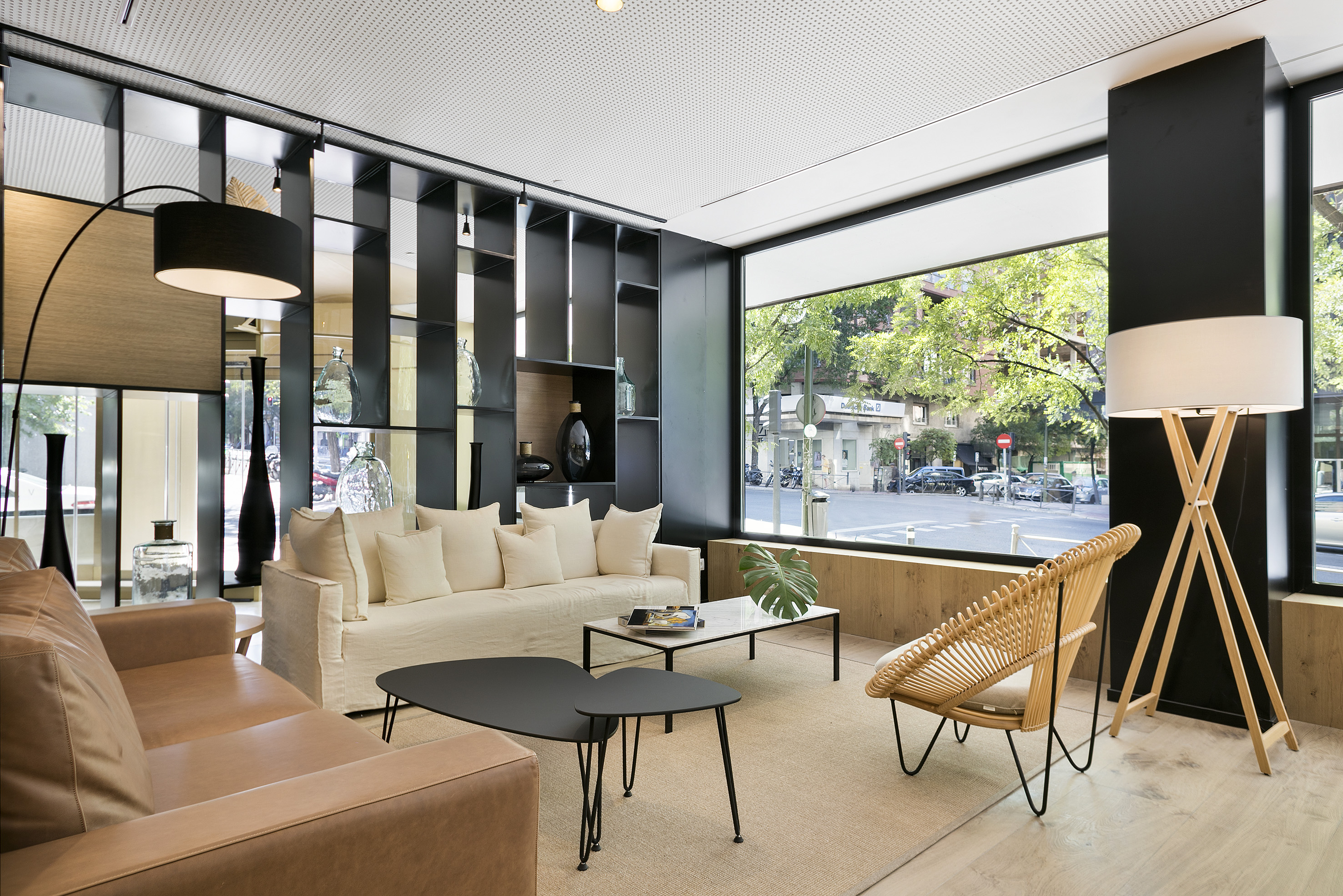 a room with a couch and chairs