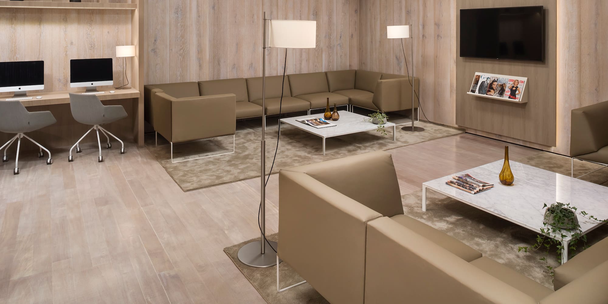 a living room with a tv and couches