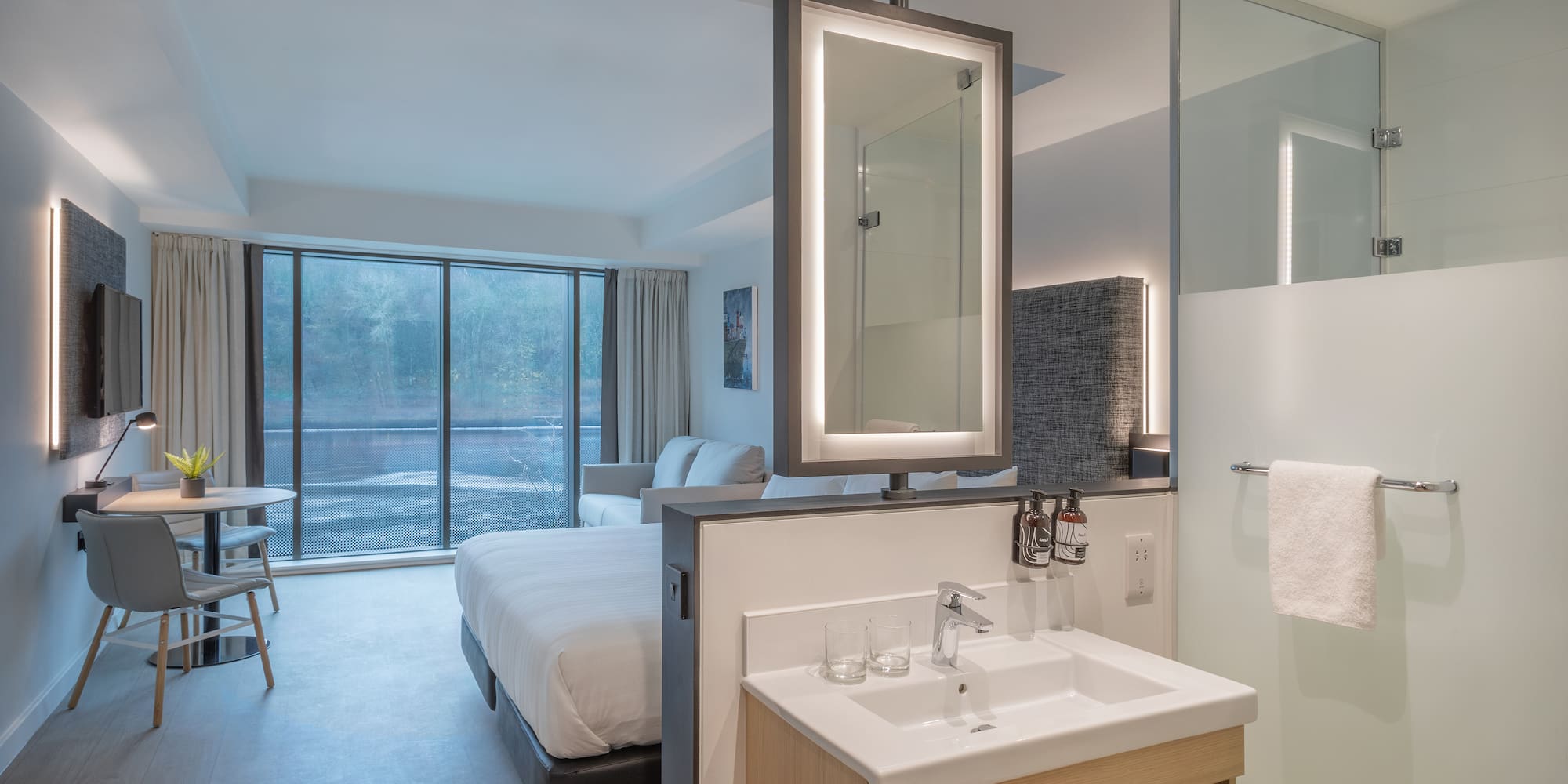 a bathroom with a bed and sink