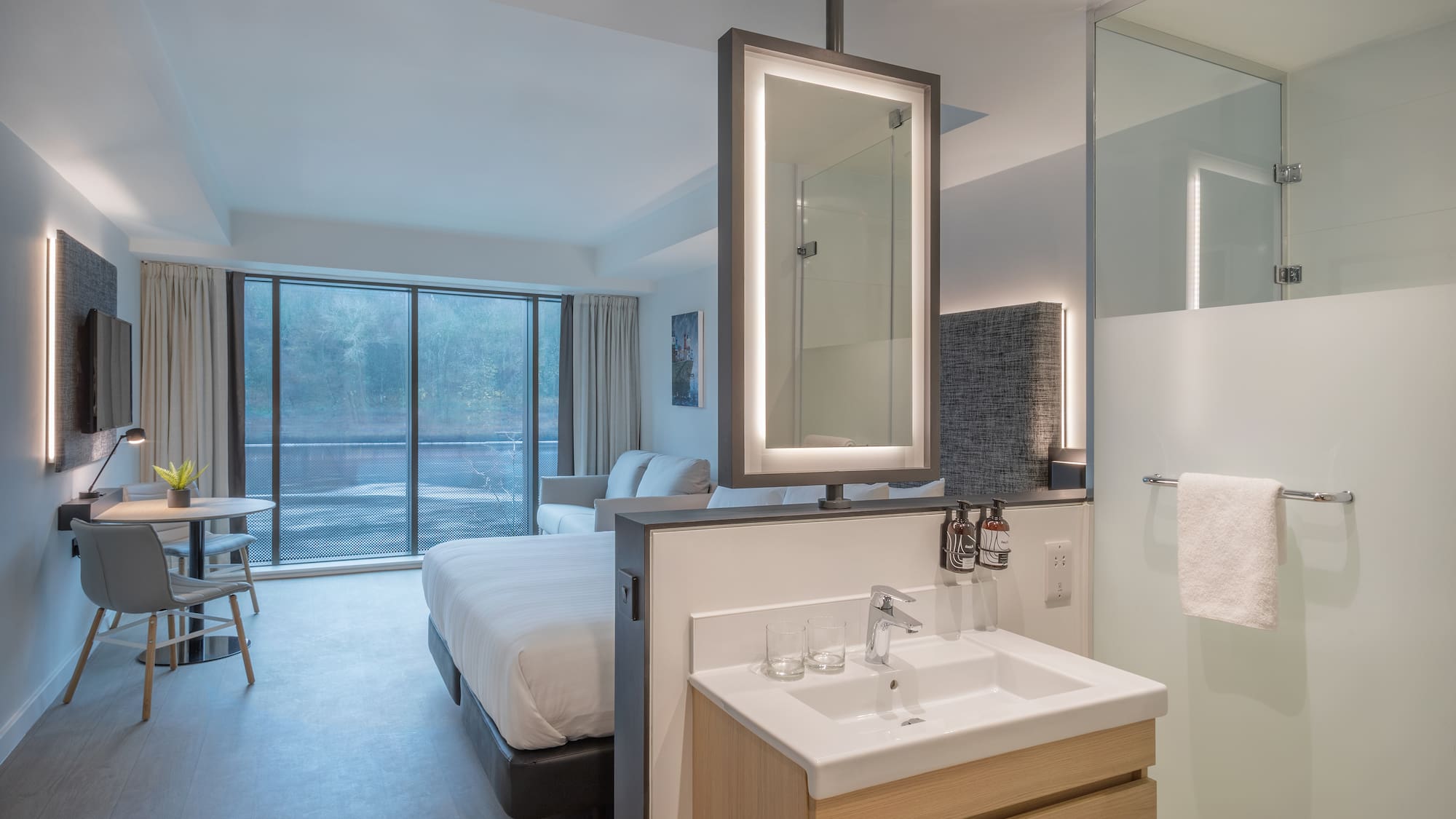 a bathroom with a bed and sink