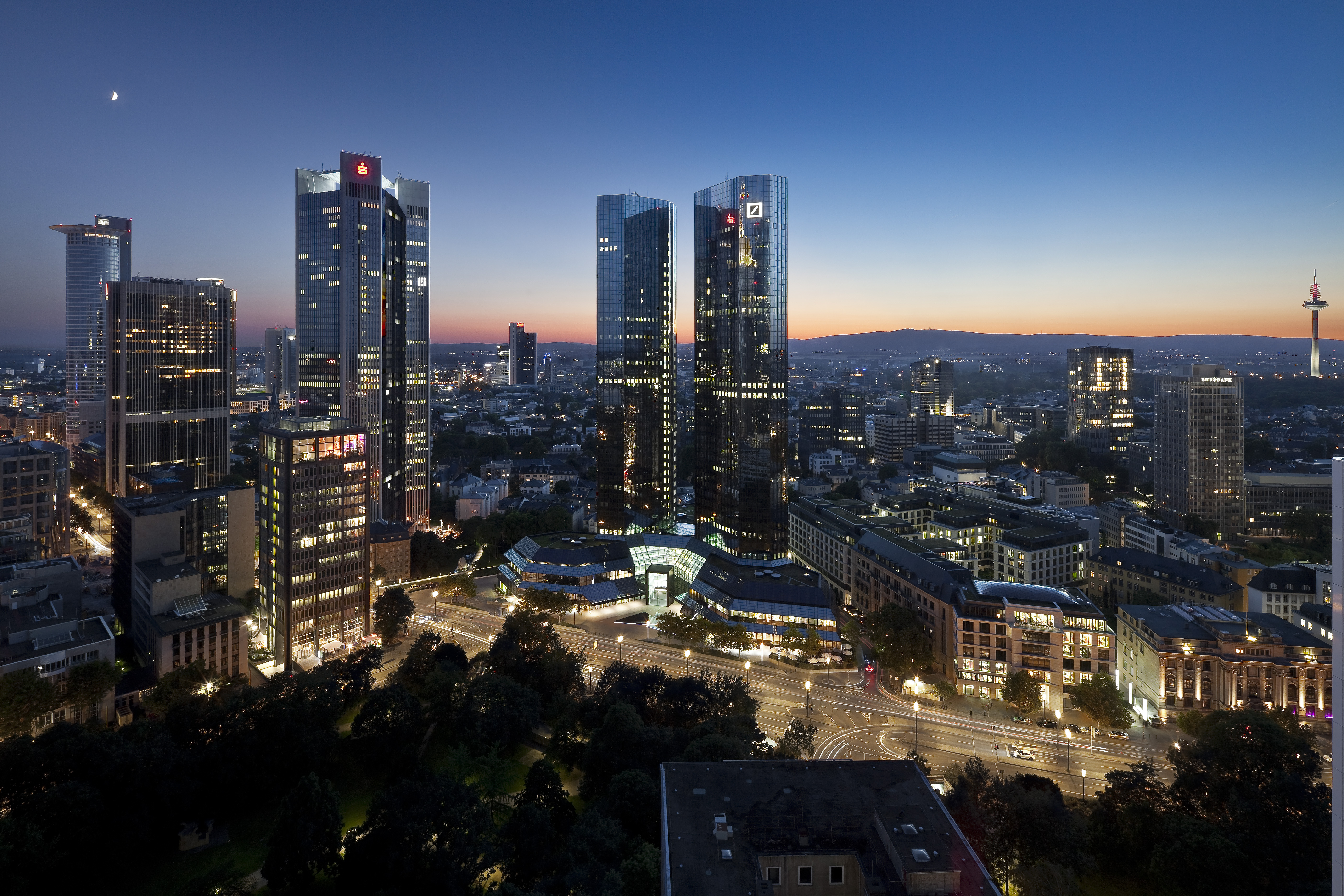 a city with tall buildings and trees