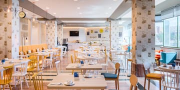 a room with tables and chairs