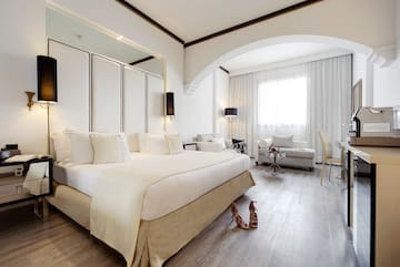 a bedroom with a bed and a mirror