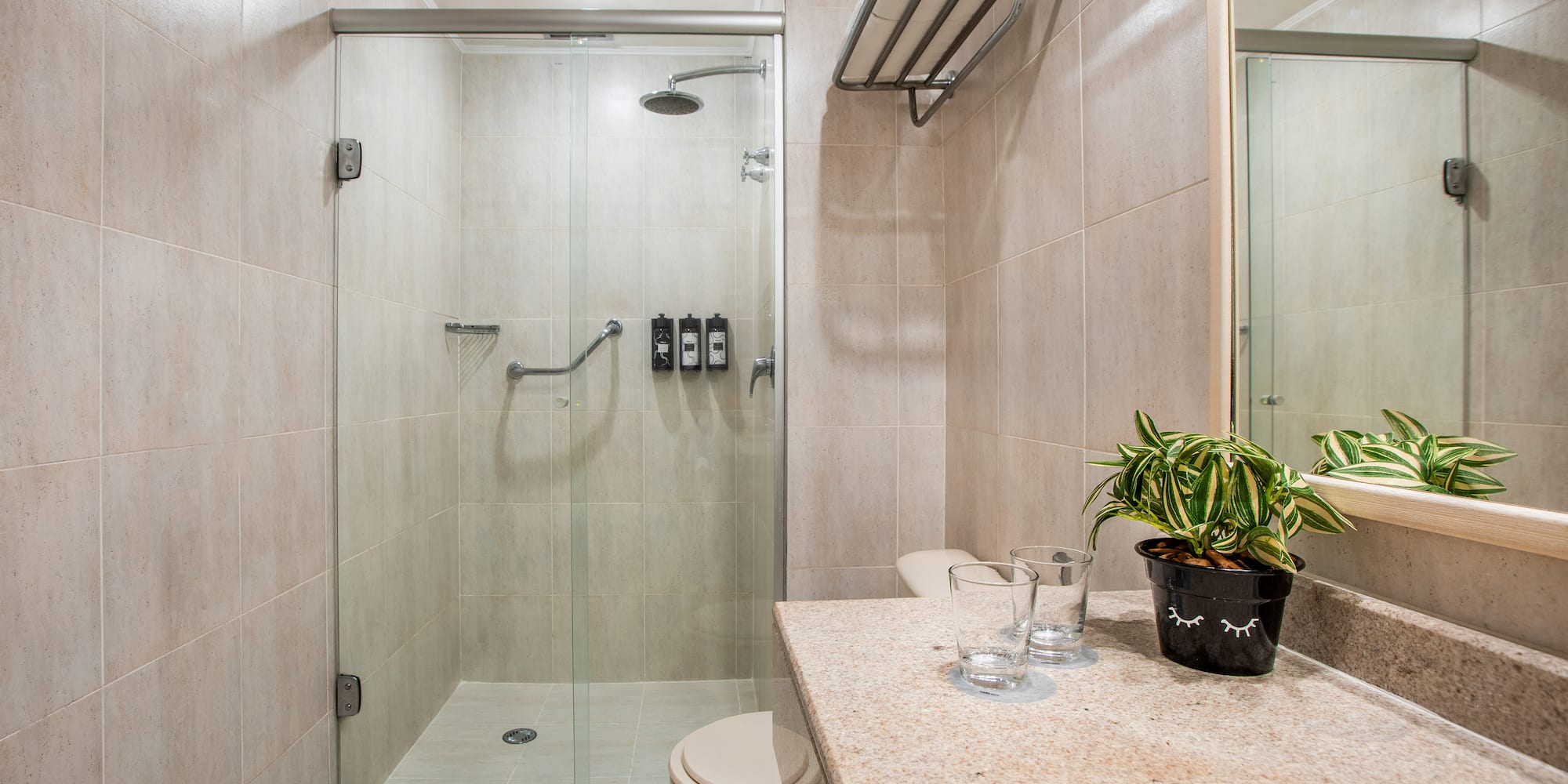 a bathroom with a shower and sink