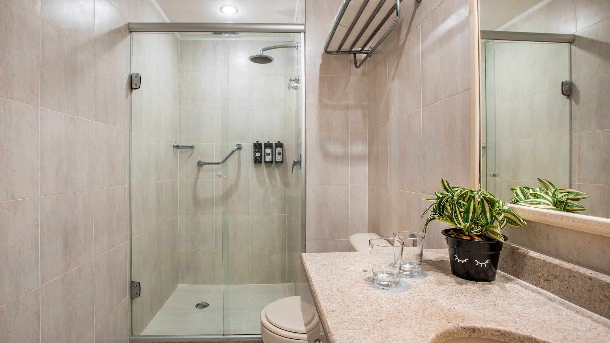 a bathroom with a shower and sink