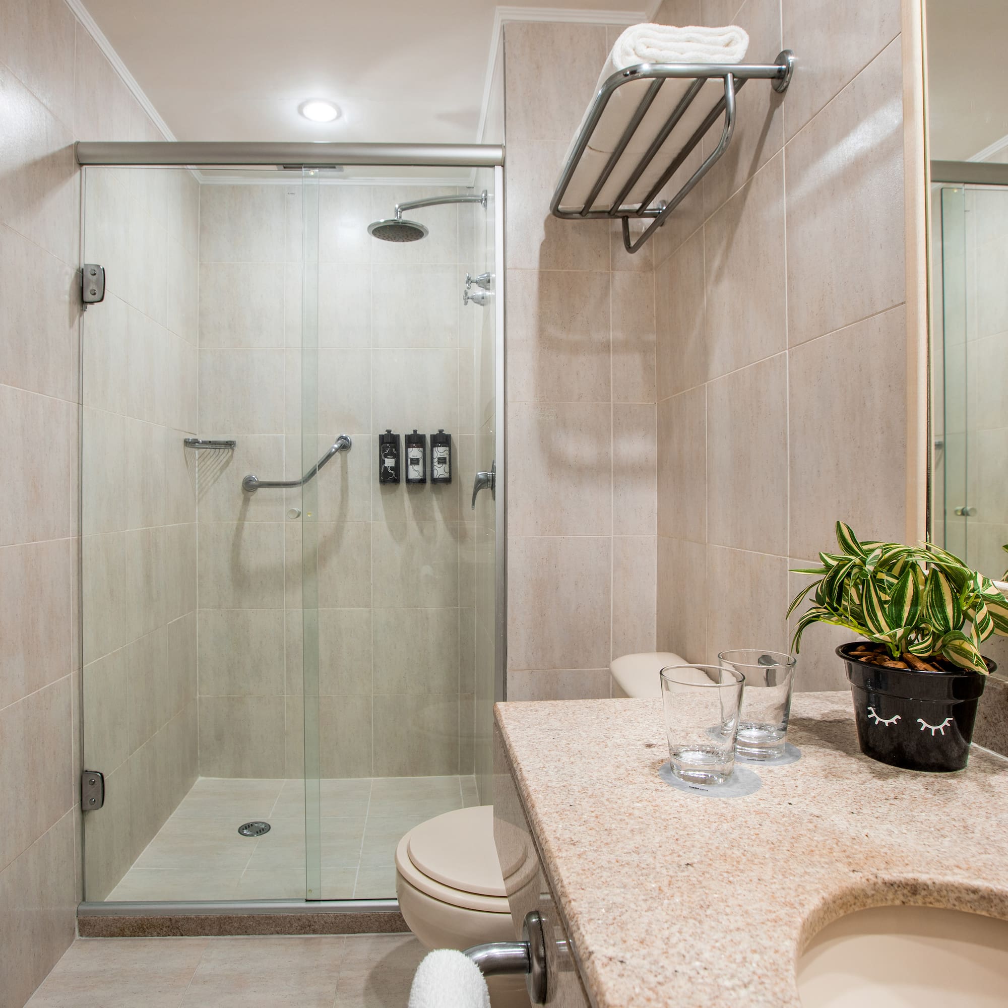 a bathroom with a shower and sink