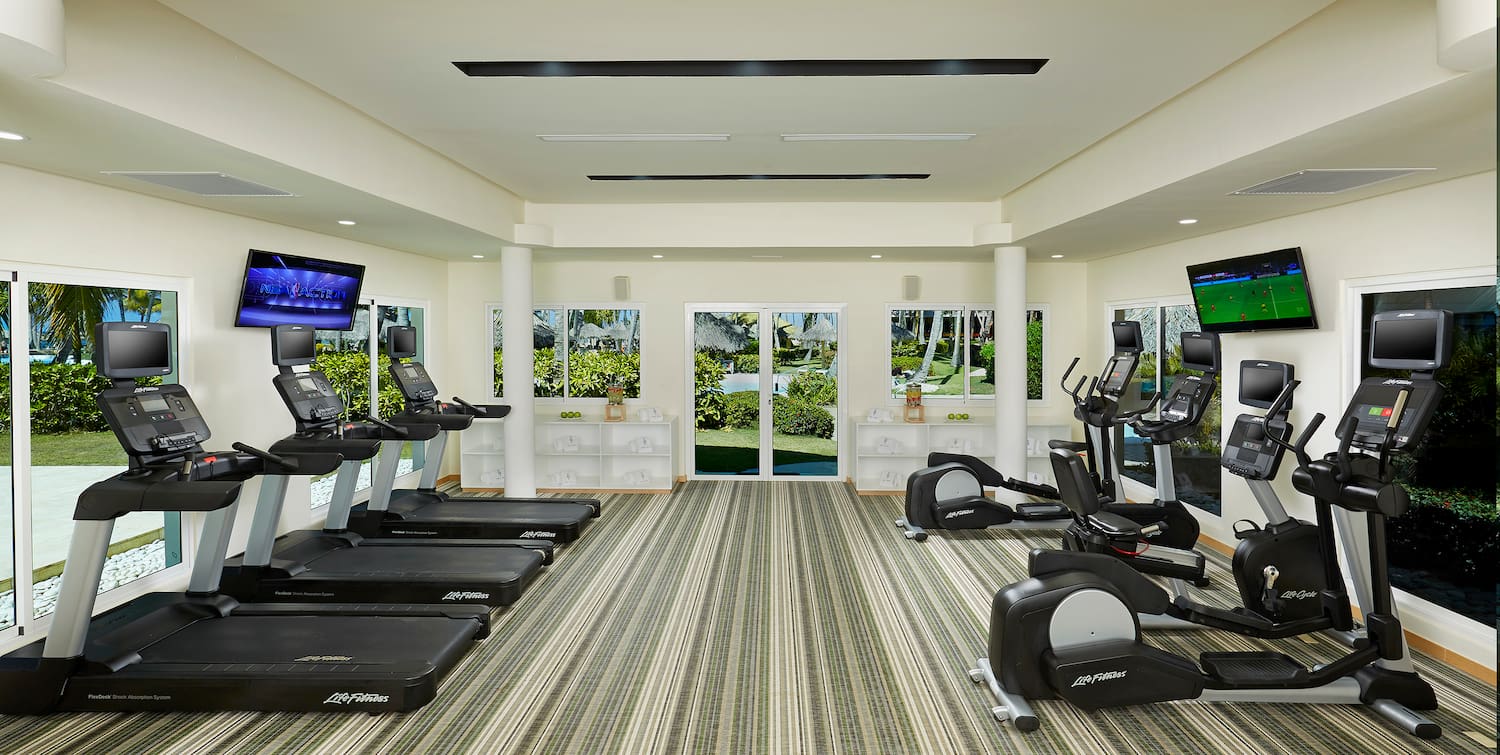 a room with treadmills and exercise machines