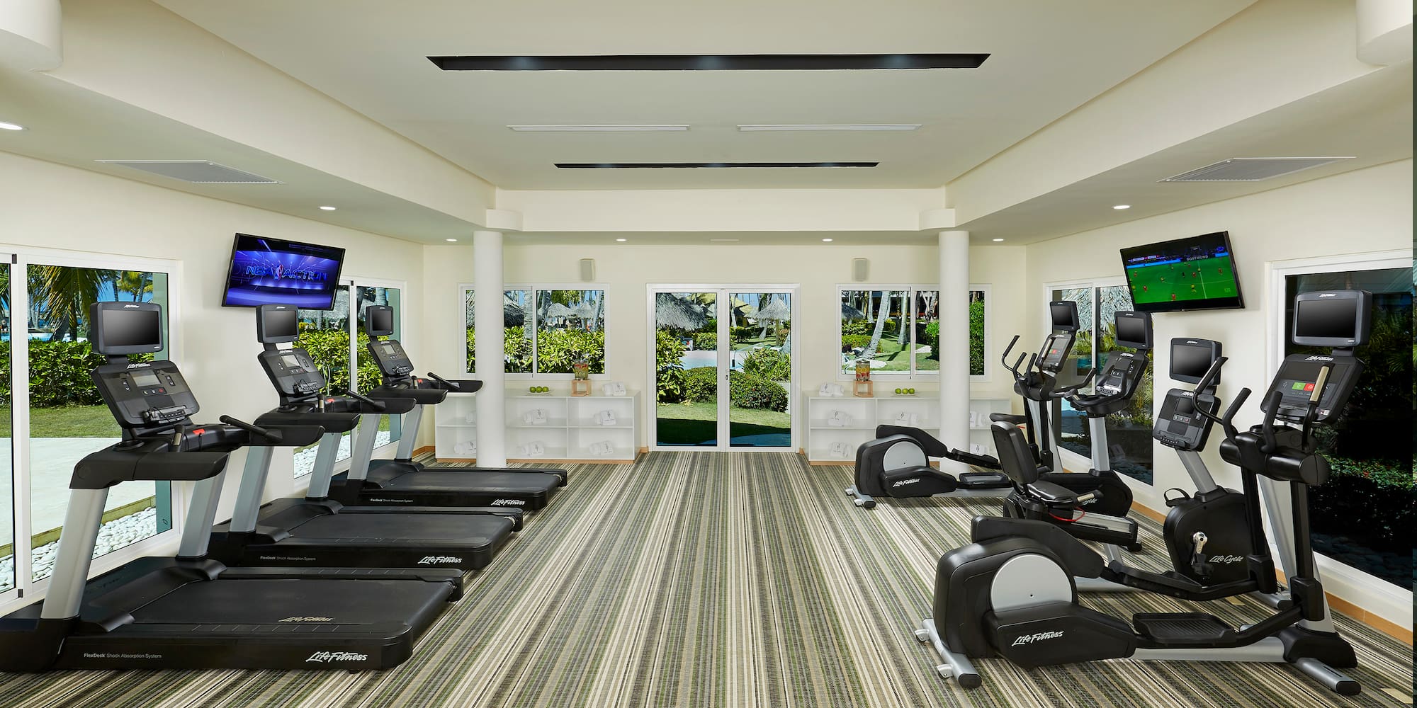 a room with treadmills and exercise machines