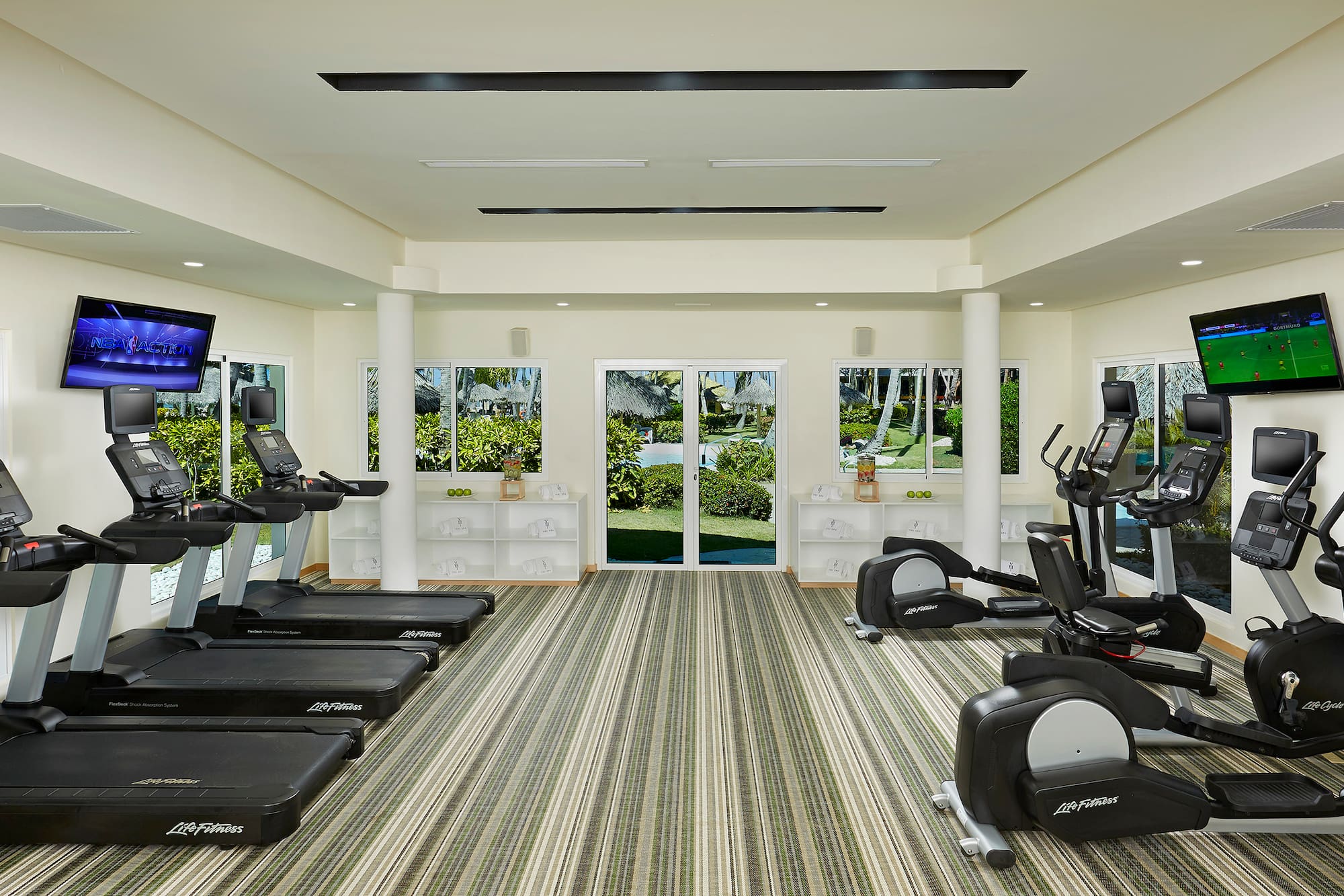 a room with treadmills and exercise machines