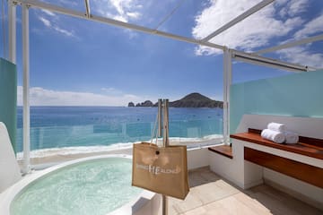 a hot tub overlooking the ocean