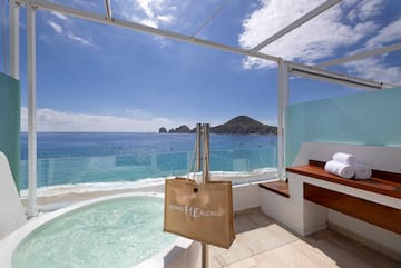 a hot tub overlooking the ocean