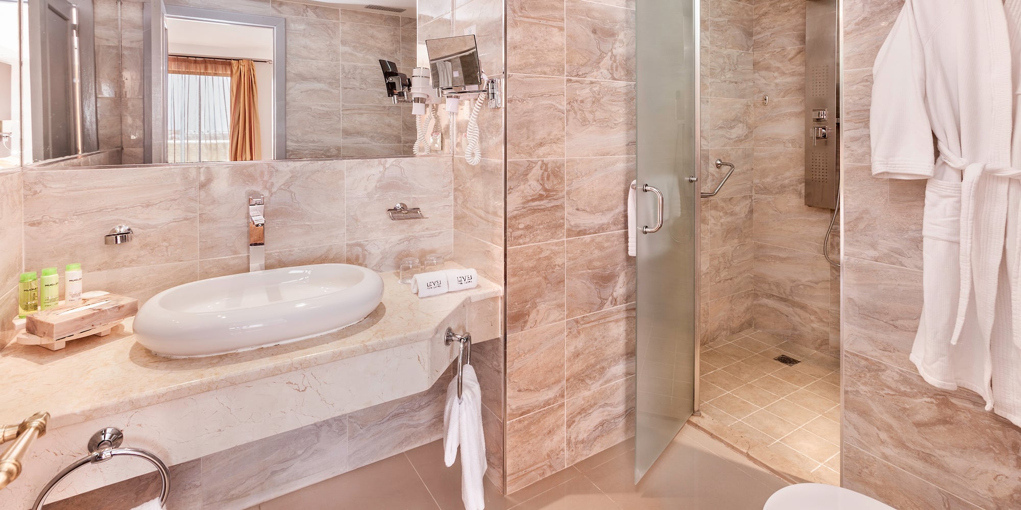 a bathroom with a sink and shower