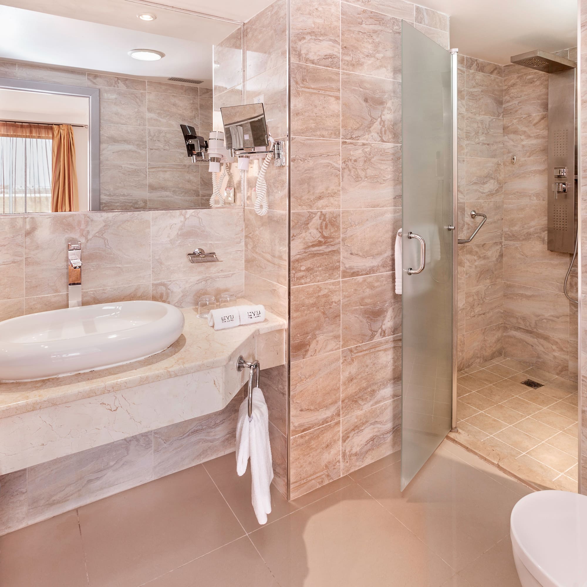 a bathroom with a sink and shower