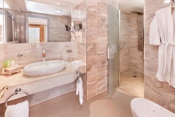 a bathroom with a sink and shower