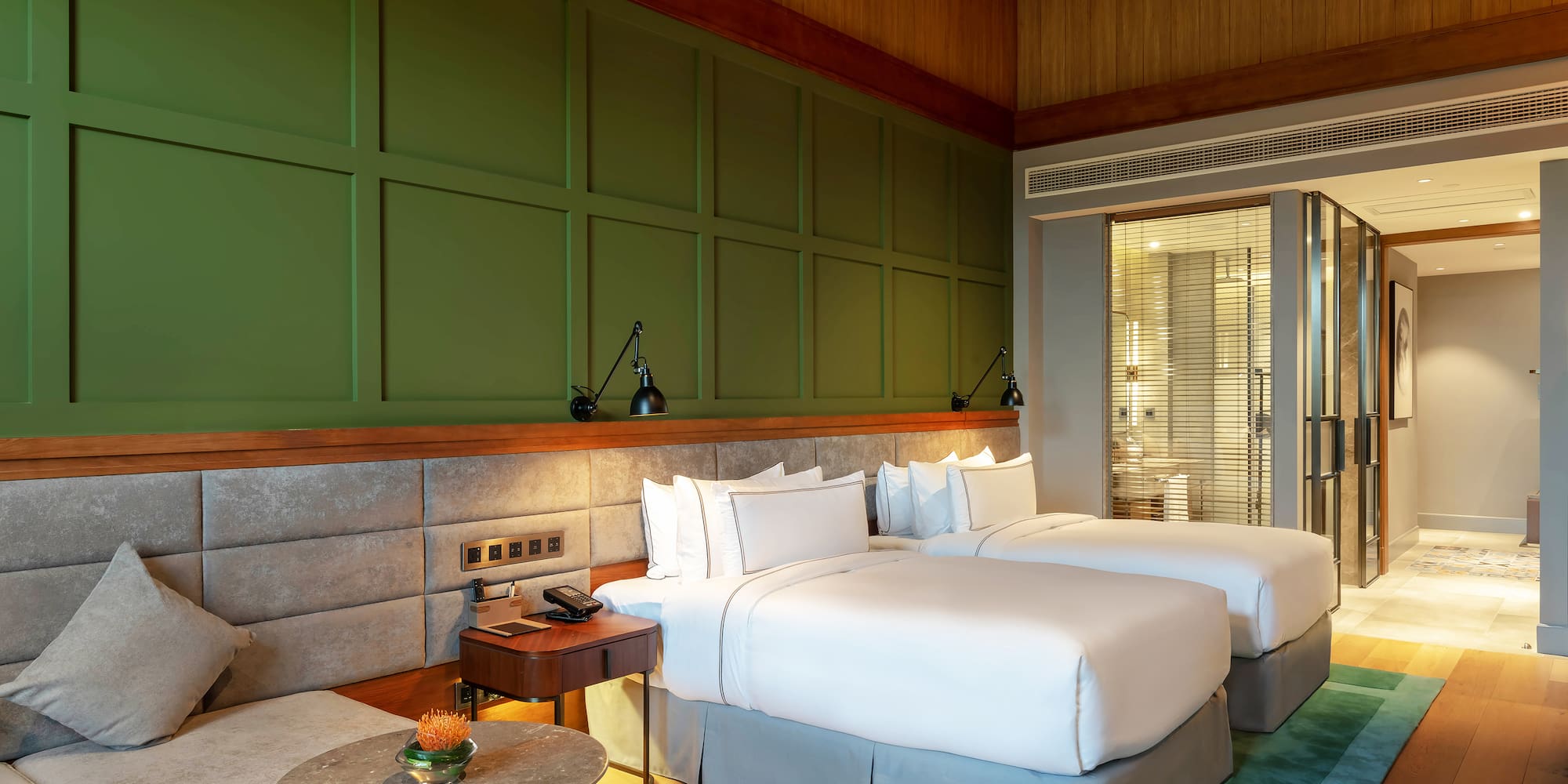 a room with two beds and a table