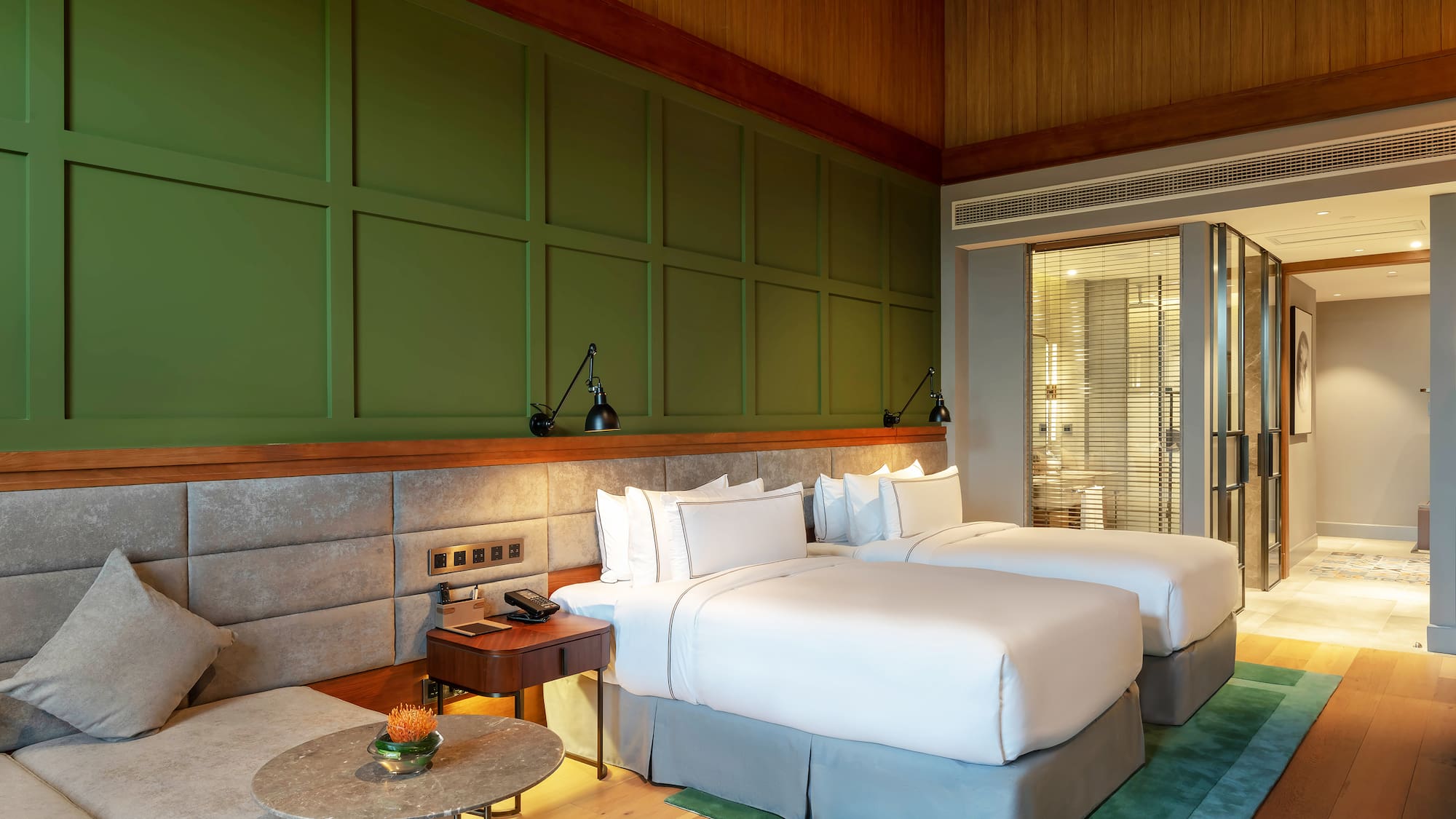 a room with two beds and a table