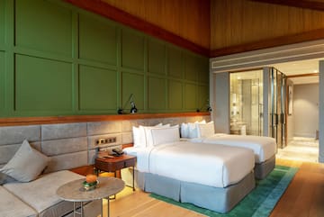 a room with two beds and a table