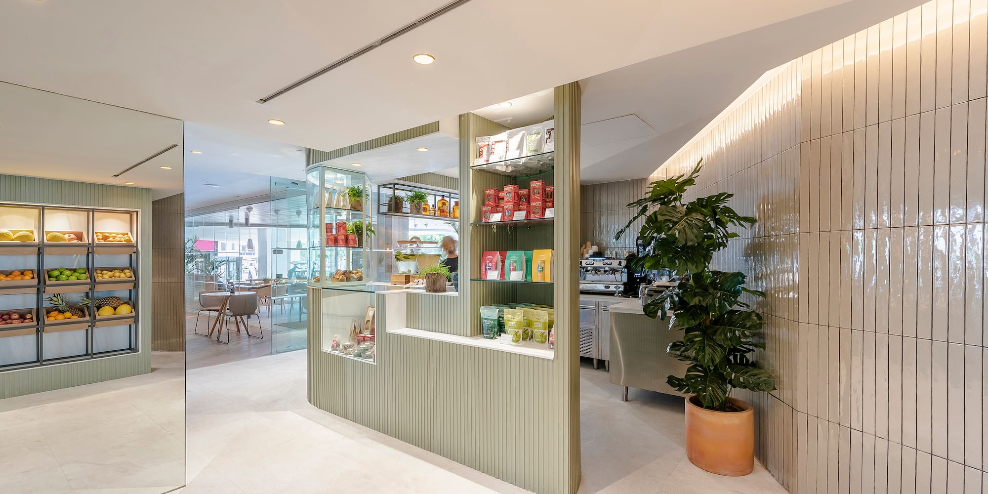 a room with a glass wall and shelves