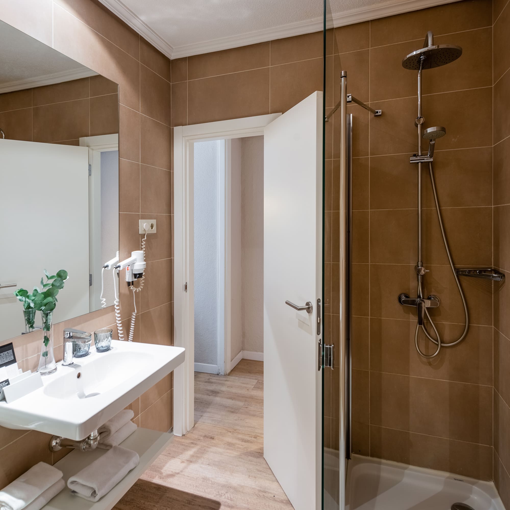 a bathroom with a shower and sink