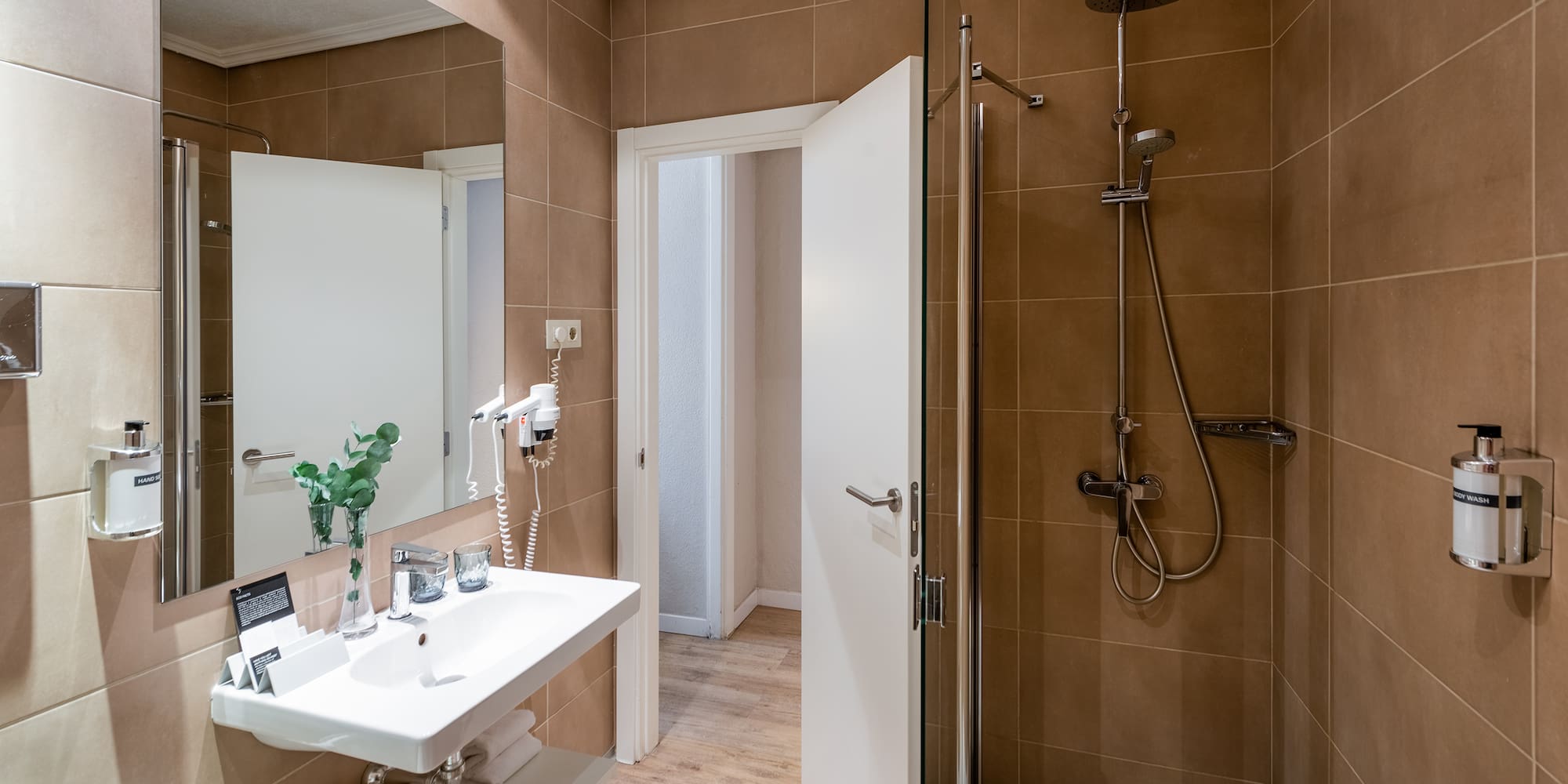 a bathroom with a shower and sink