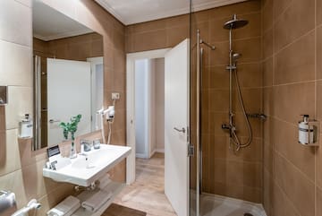 a bathroom with a shower and sink