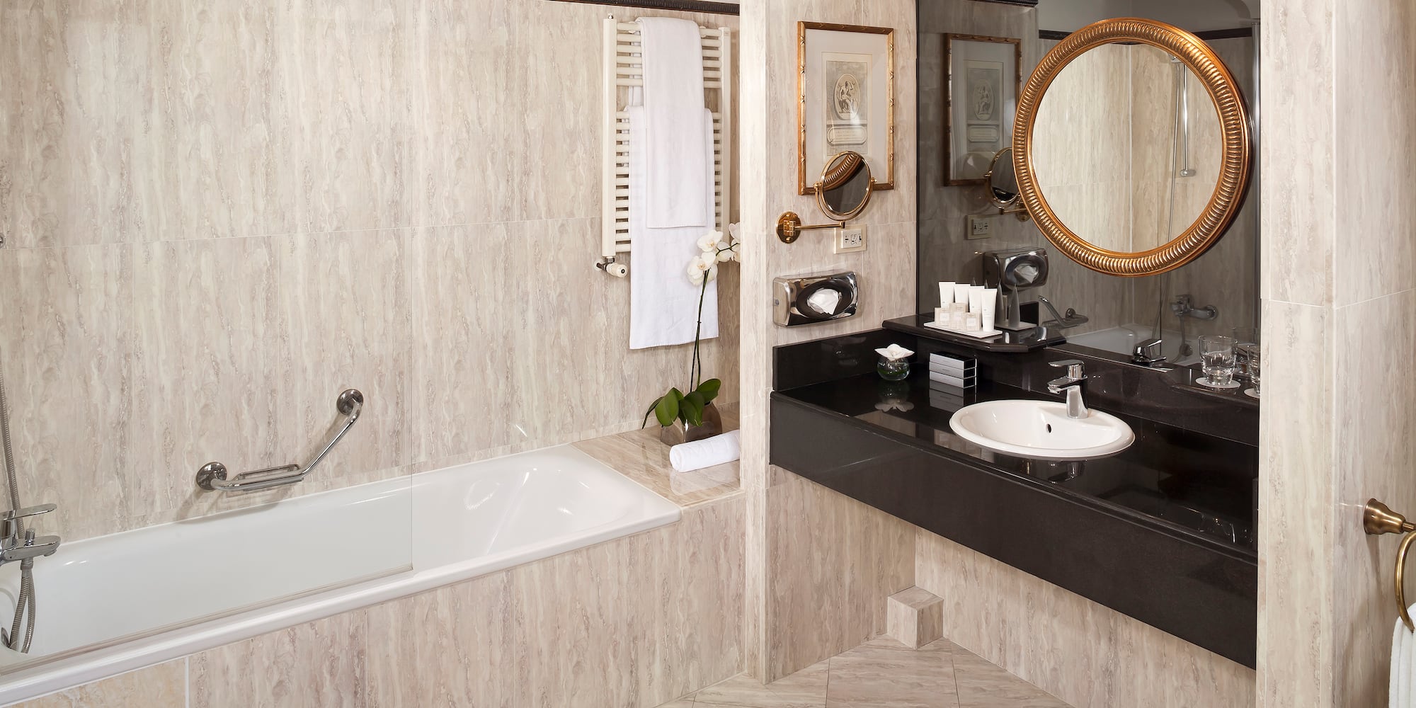 a bathroom with a tub and sink