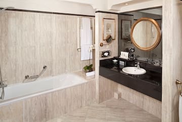 a bathroom with a tub and sink