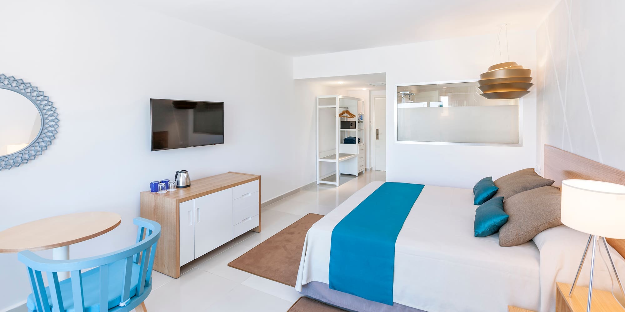 a bedroom with a bed and a table