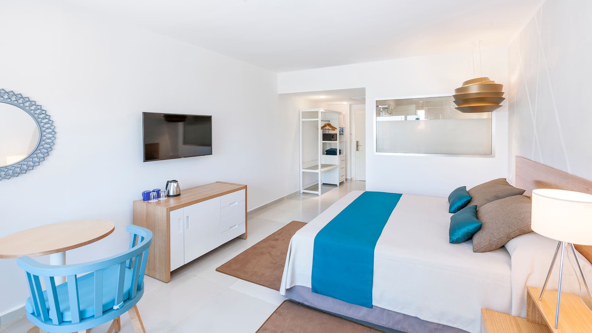 a bedroom with a bed and a table