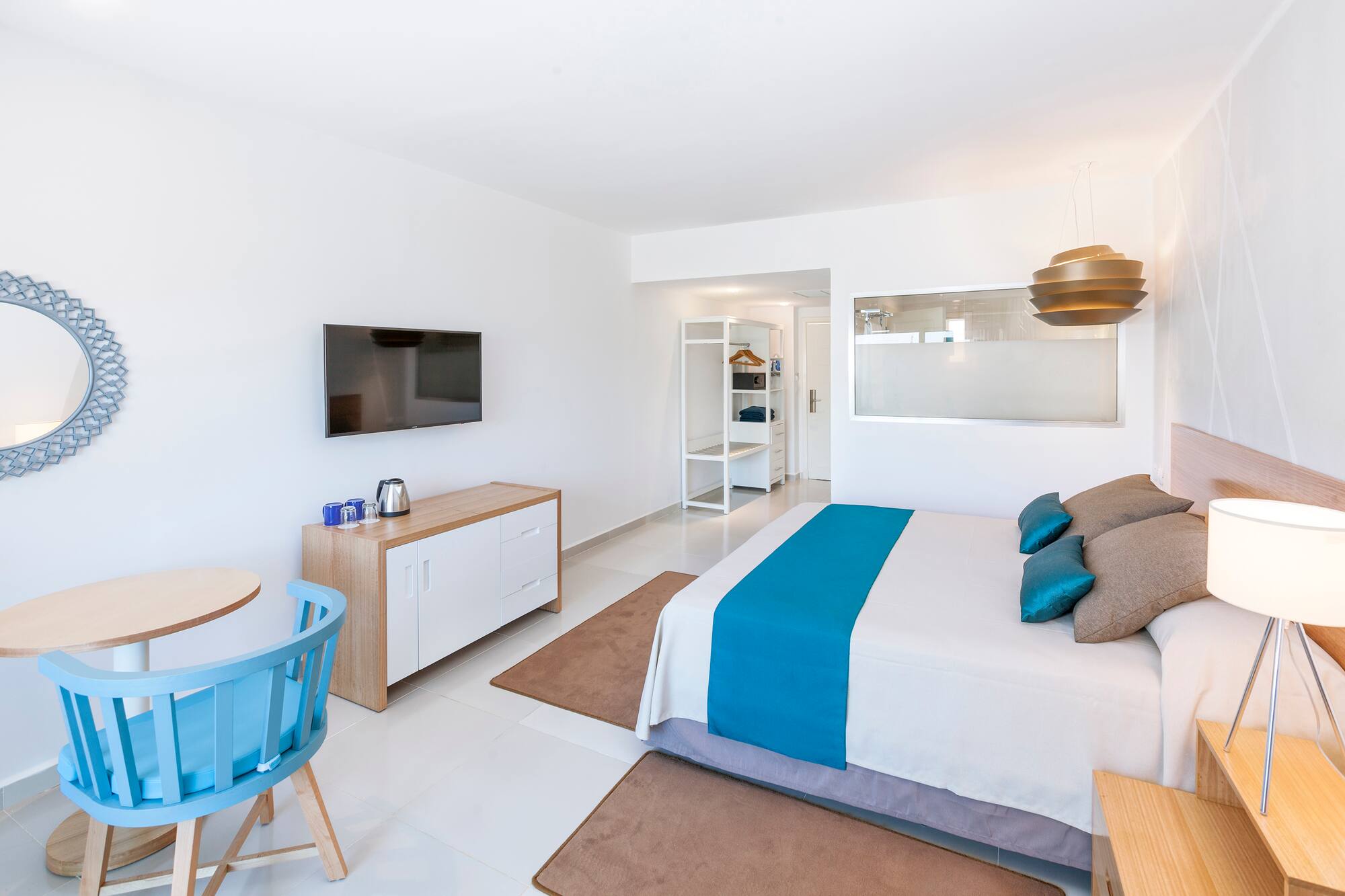 a bedroom with a bed and a table