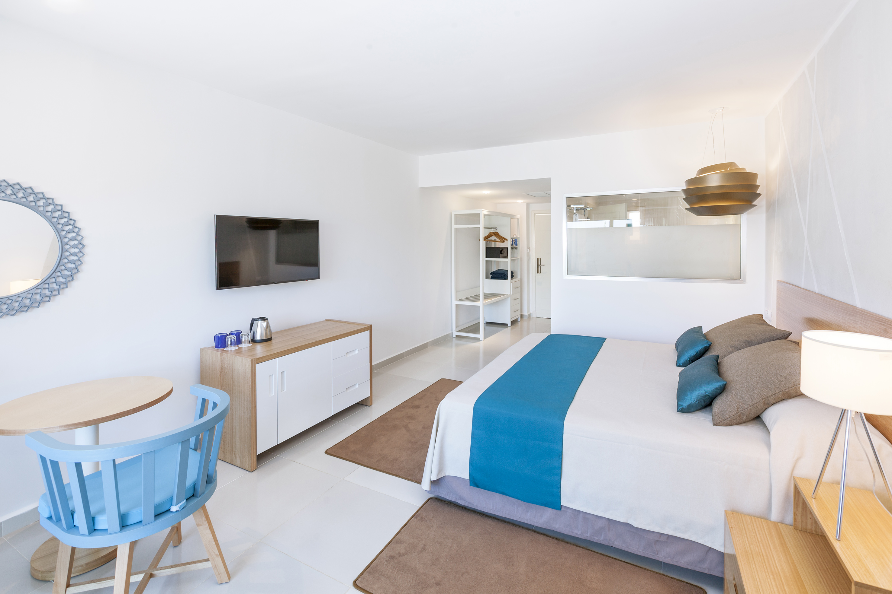 a bedroom with a bed and a table